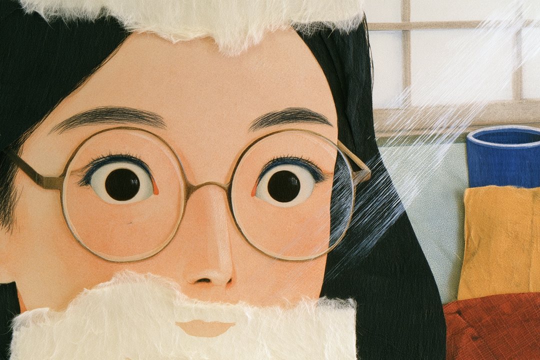 細い横の帯の寄り。丸い眼鏡の奥で、まん丸に見開いた娘の目。